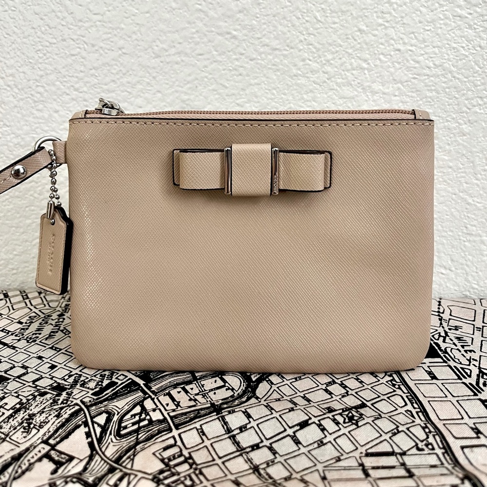Coach Wristlet with bow Color: Sand/tan 6.25"W x 4.25"H x .25 D